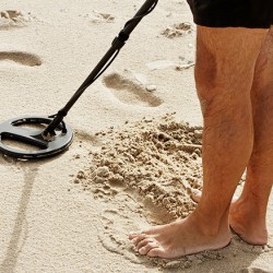 Looking for wedding ring on beach