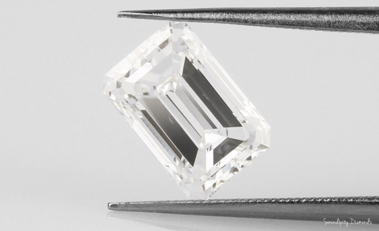 SI1 Feather shown within a large Emerald cut eye-clean diamond.