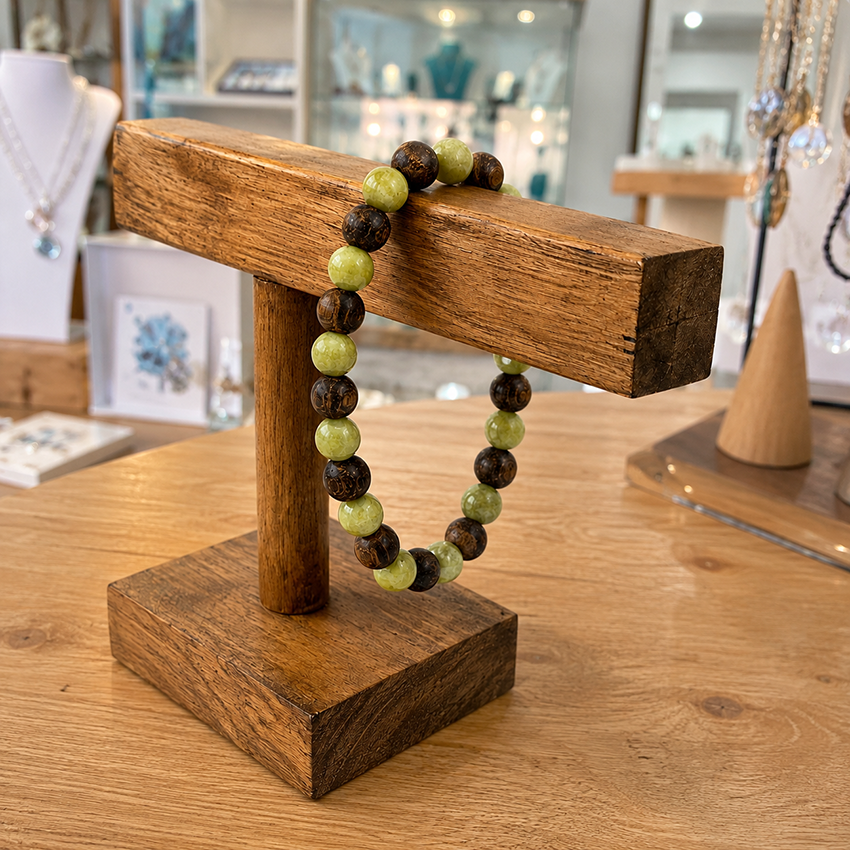 Peridot and bronzite bracelet with alternating 8mm gemstone beads, photographed in our Isle of Wight showroom.