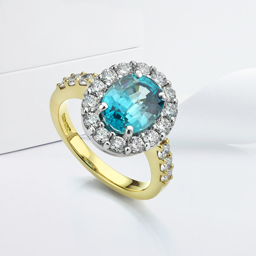 Bespoke Blue Zircon and Diamond Cluster made by bespoke design.