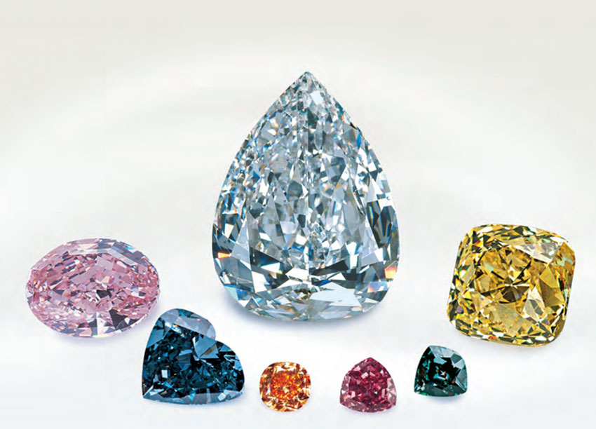 Selection of 7 rare gem diamonds including the Pumpkin diamond in the foreground