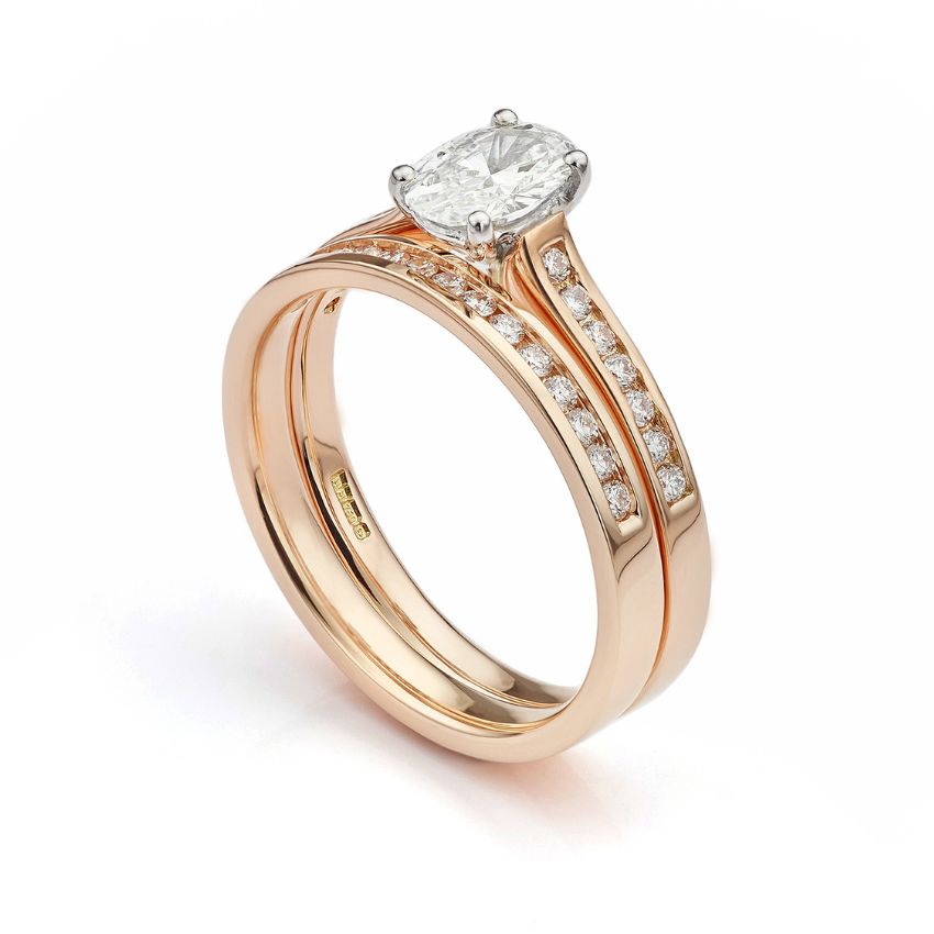 Oval diamond shoulder engagement ring