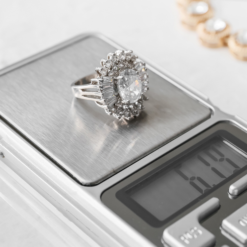 engagement ring weighed on scales