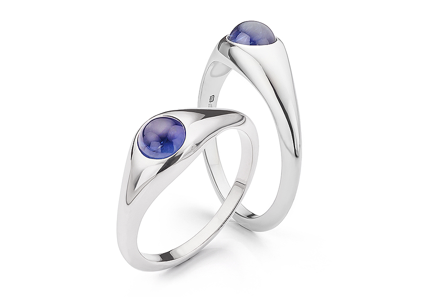 Polished cab blue sapphire ring in Platinum. 