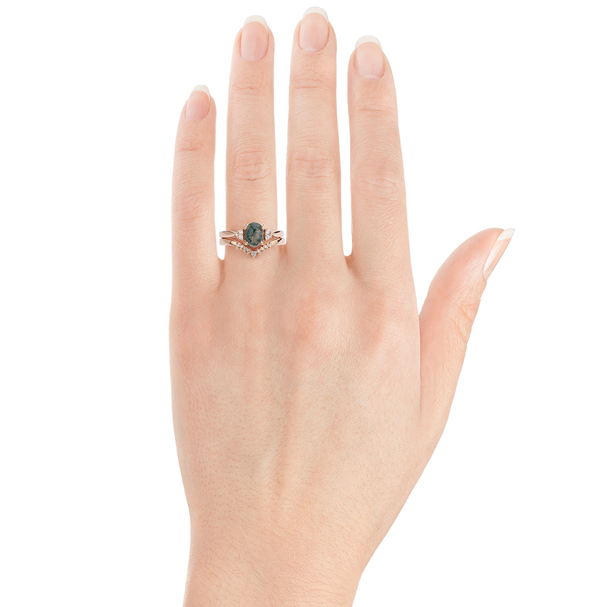 Wishbone wedding ring shown on the hand with a matching engagement ring.