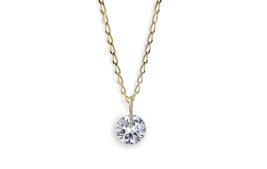 Floating diamond necklace created with a drilled round brilliant cut diamond. 