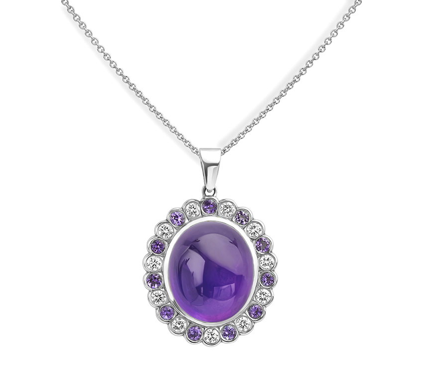 Amethyst and diamond bespoke necklace featuring an oval cabochon amethyst at the centre of the design.