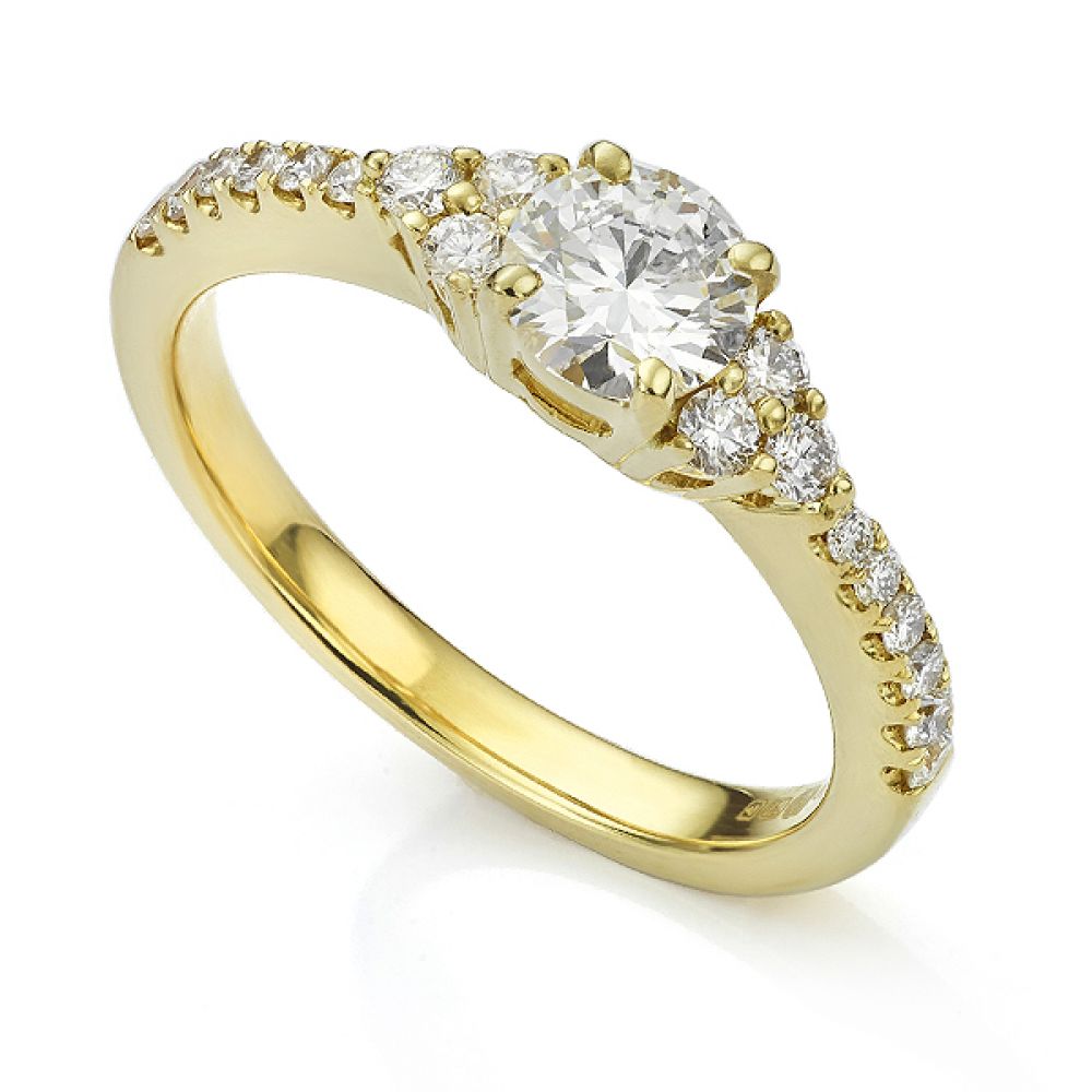 Christie diamond shoulder engagement ring in Yellow Gold