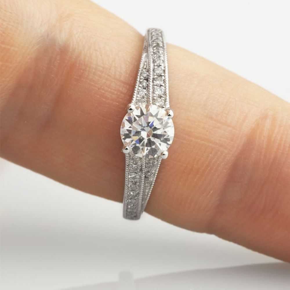 Vintage Diamond Engagement Ring with Stepped Shoulders Shown On Finger