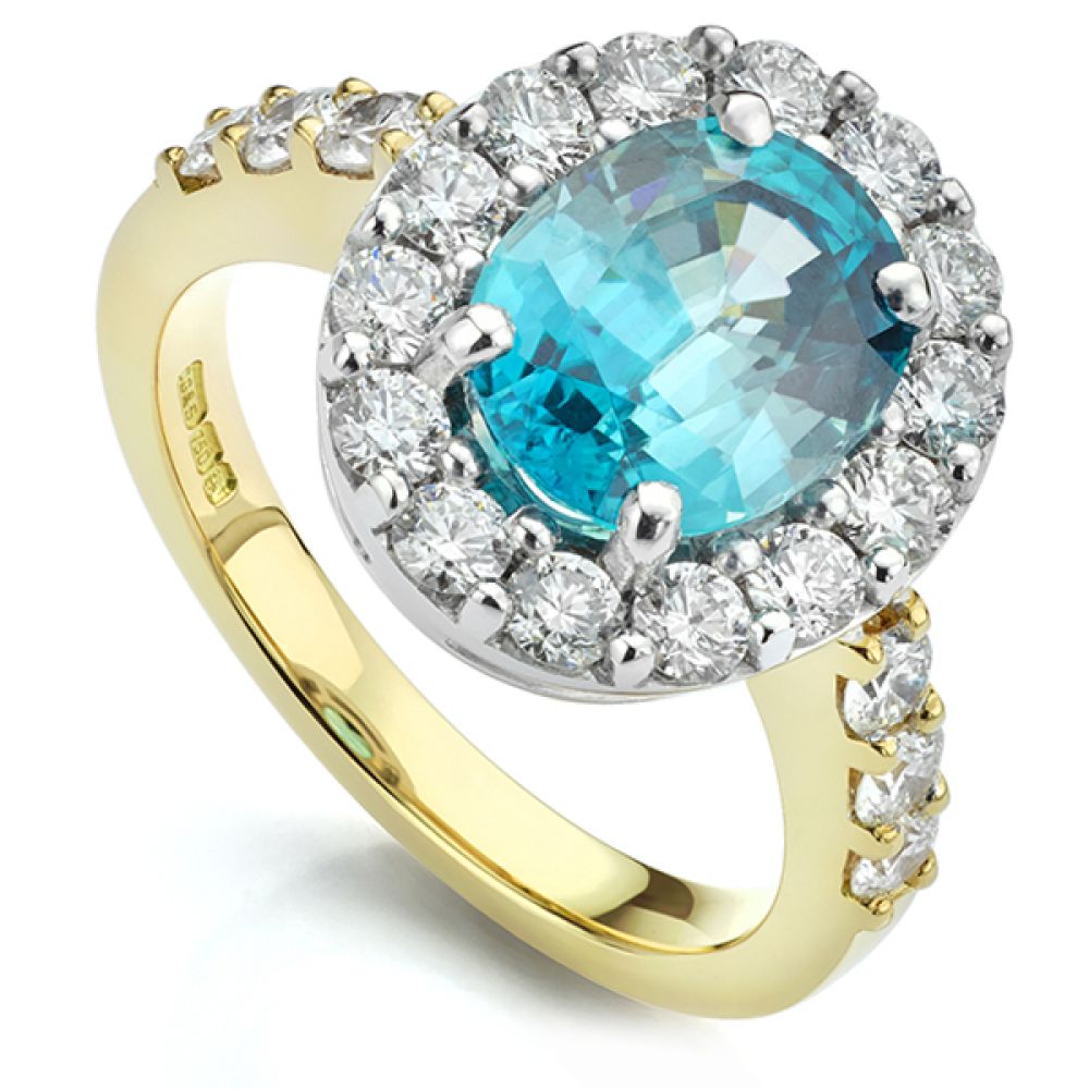 Bespoke Blue Zircon and Diamond Halo Ring in Yellow Gold