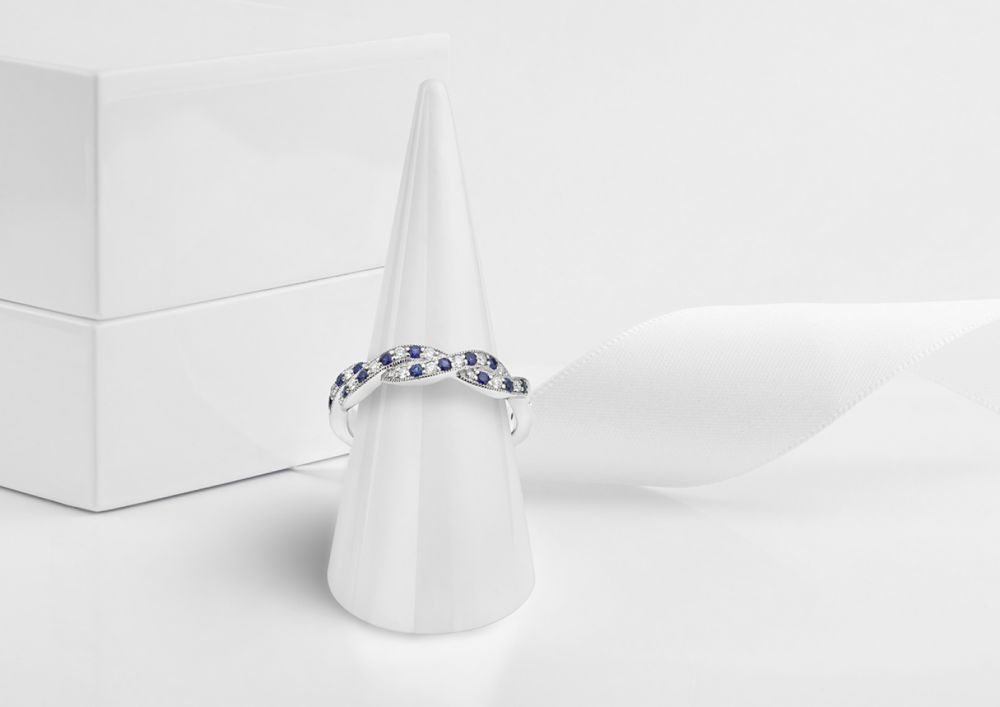Blue sapphire wedding ring on display cone Blue sapphire wedding ring on display cone