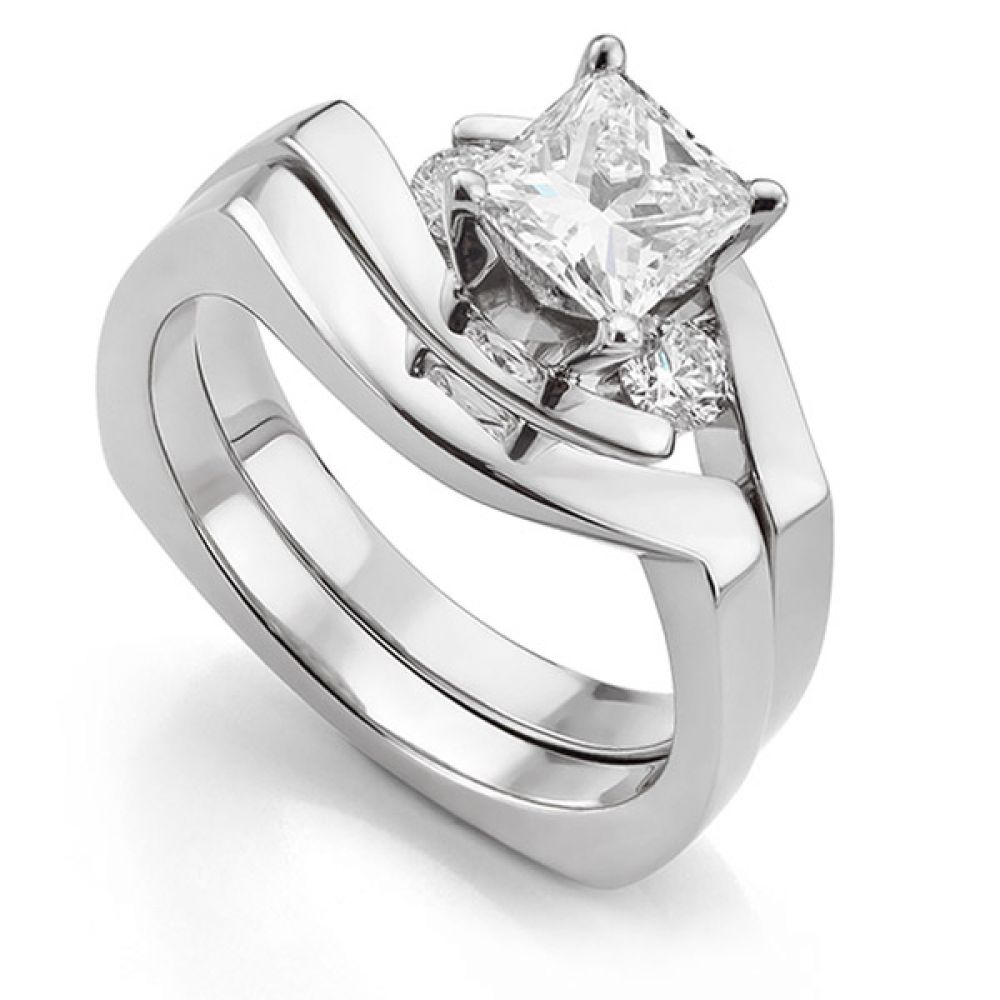 Four sided engagement ring with bespoke shaped wedding ring