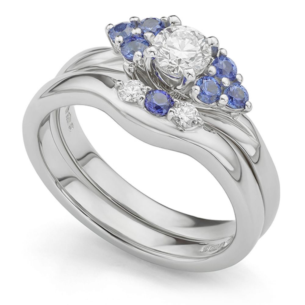 Bespoke shaped blue sapphire and diamond wedding ring with engagement ring