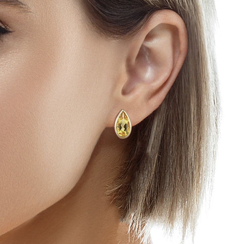 Yellow Beryl Pear Drop Earrings shown in the ear Yellow Beryl Pear Drop Earrings shown in the ear