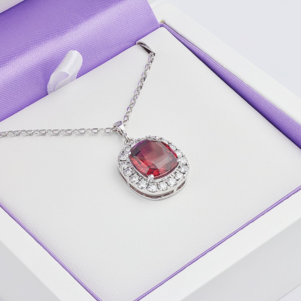 Garnet and Diamond Halo Necklace in Serendipity Diamonds Presentation Box Garnet and Diamond Halo Necklace in Serendipity Diamonds Presentation Box