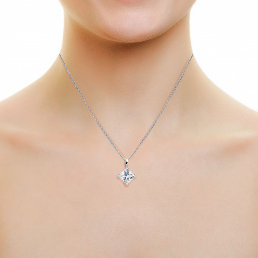 Princess cut diamond pendant on chest Princess cut diamond pendant on chest