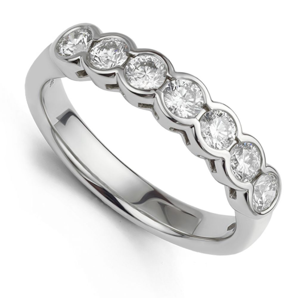 Bezel set half diamond eternity ring in white gold