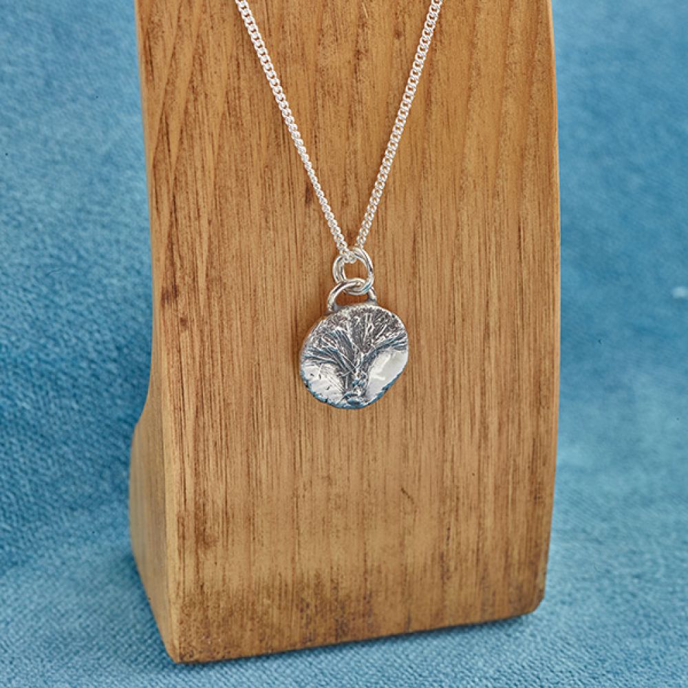 Isle of Wight Seaweed Pendant in Silver Shown on Display Stand