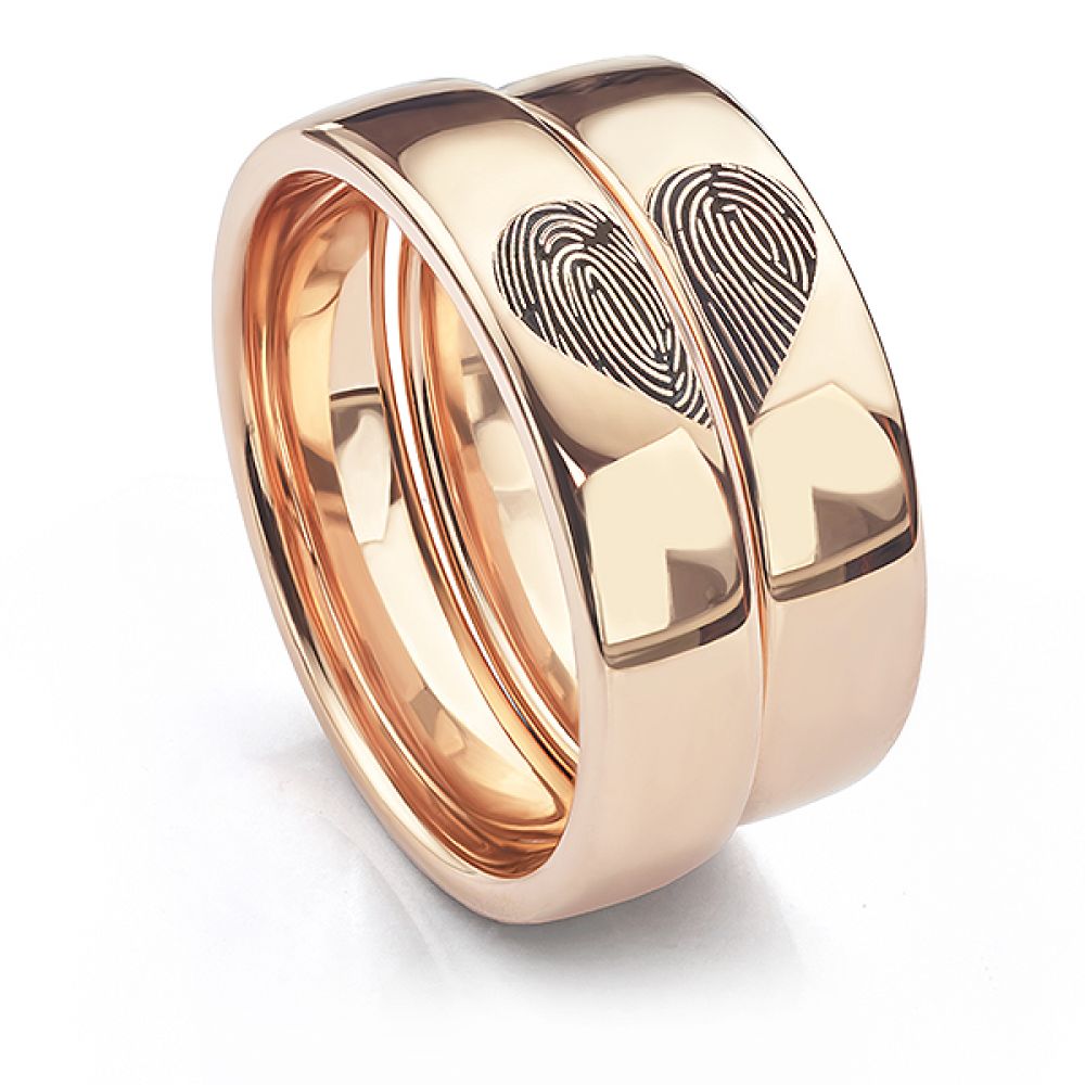 Arreton wedding rings engraved with a heart fingerprint pattern Arreton wedding rings engraved with a heart fingerprint pattern