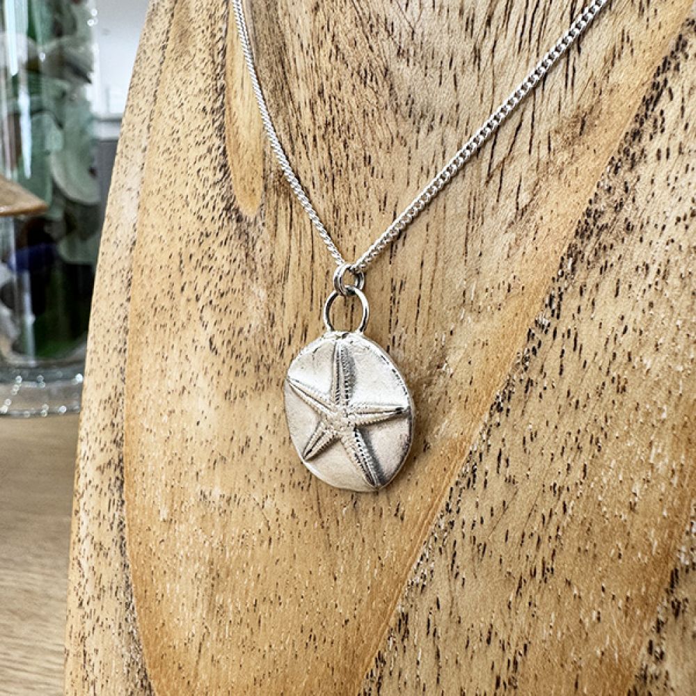 Silver Starfish Medallion Pendant on Wood Display Stand