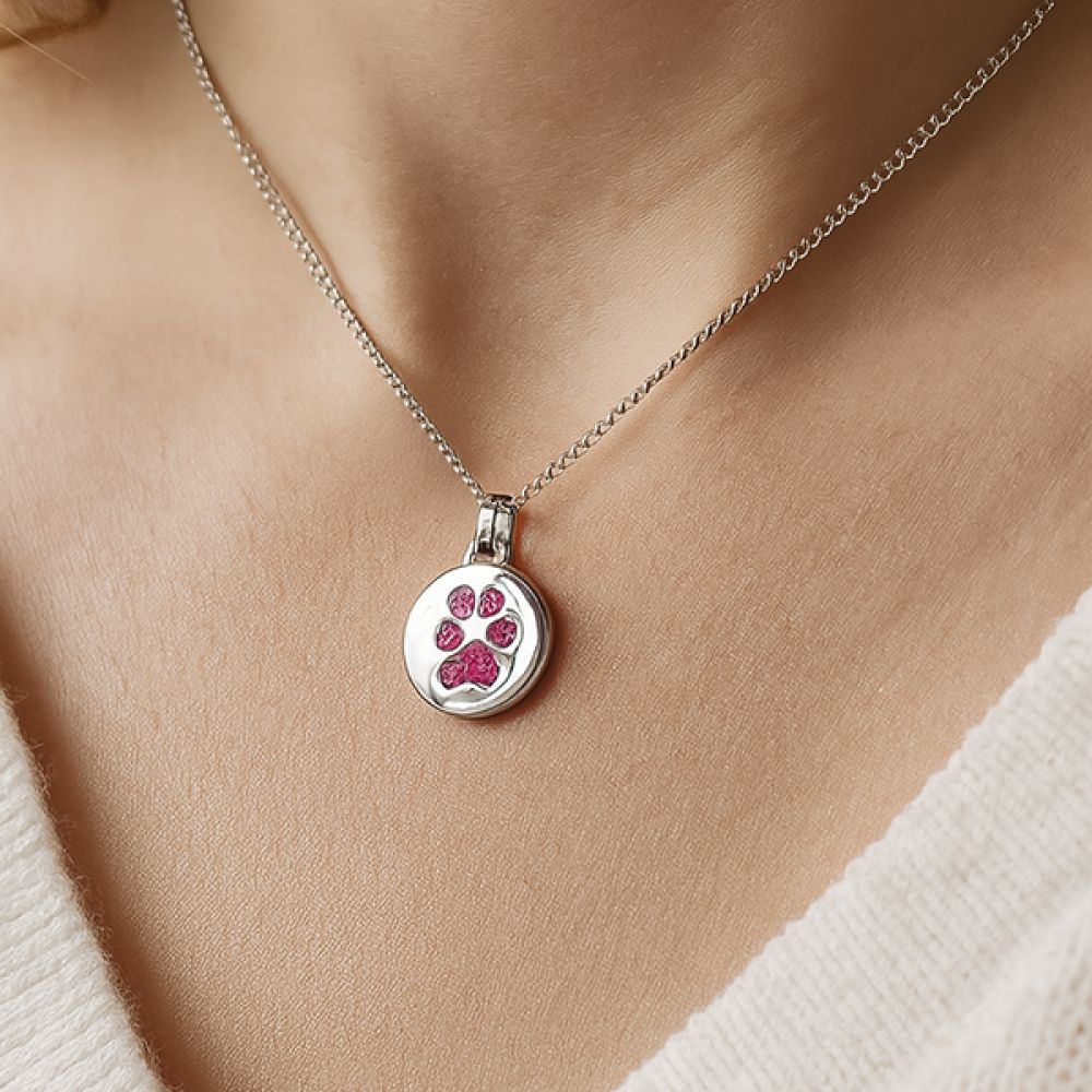 Paw print pendant worn around the neck Paw print pendant worn around the neck