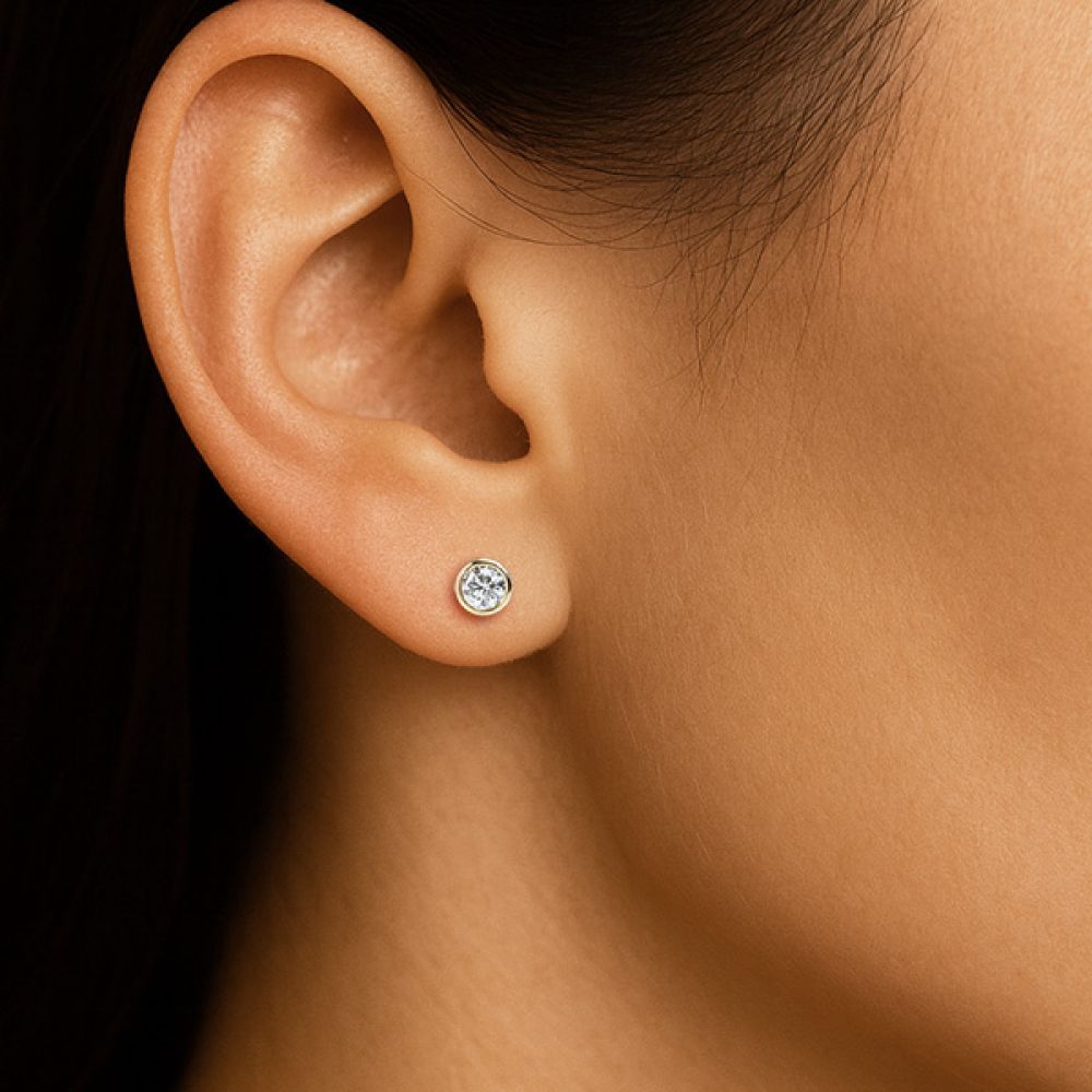 Cylindrical diamond stud earrings shown in ear Cylindrical diamond stud earrings shown in ear