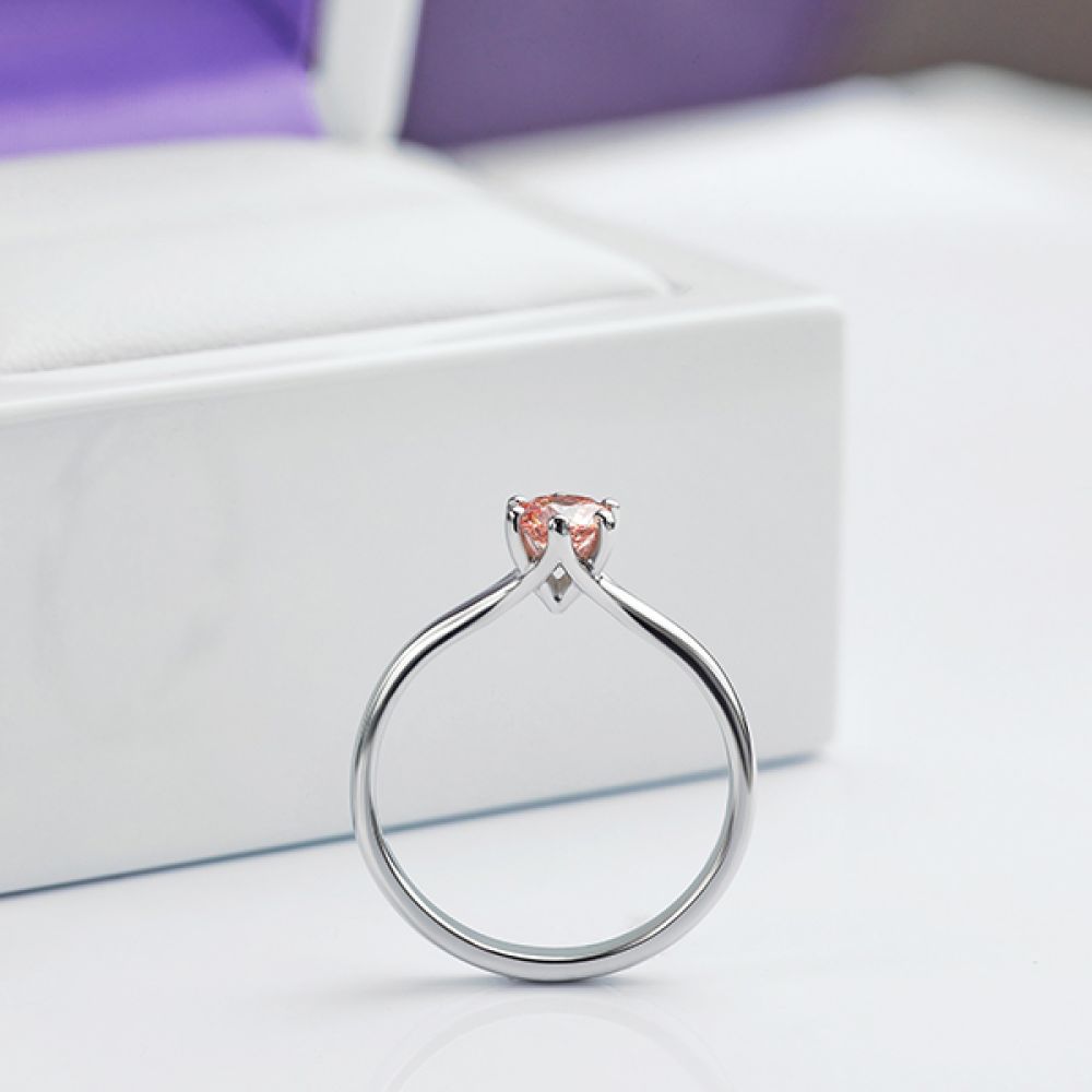 Pink Destiny engagement ring shown in ring box side view Pink Destiny engagement ring shown in ring box side view