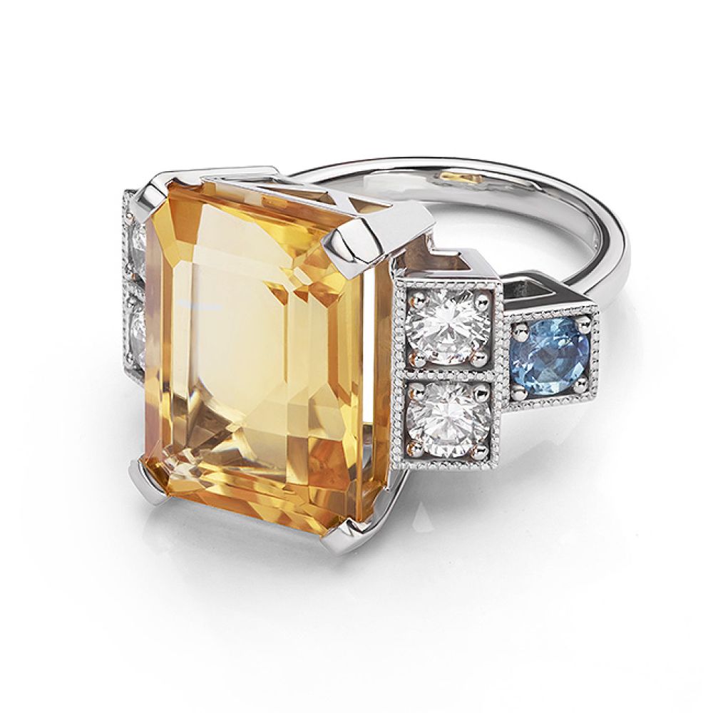 Hybrid side and front view flat on the surface showing the Citrine cocktail ring