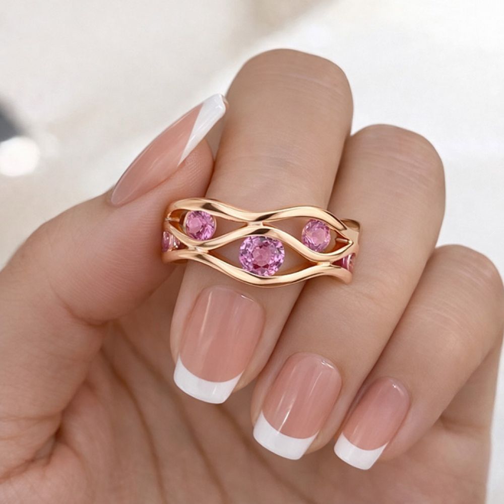 Hand photograph of pink sapphire wave ring