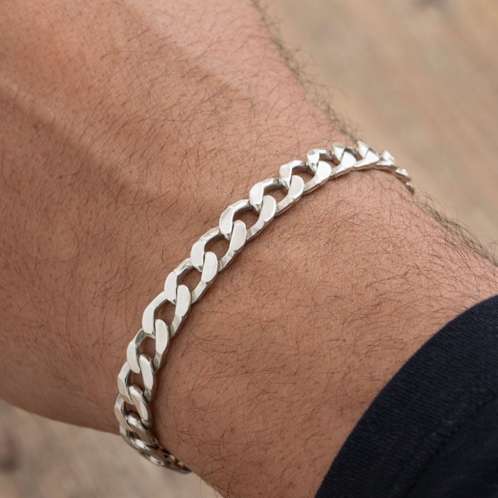 Mens pre loved silver curb bracelet on the wrist