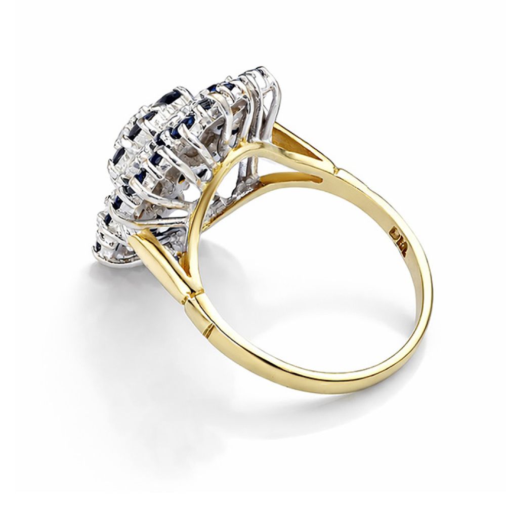 Pre-loved blue sapphire and diamond cluster floral design ring side view