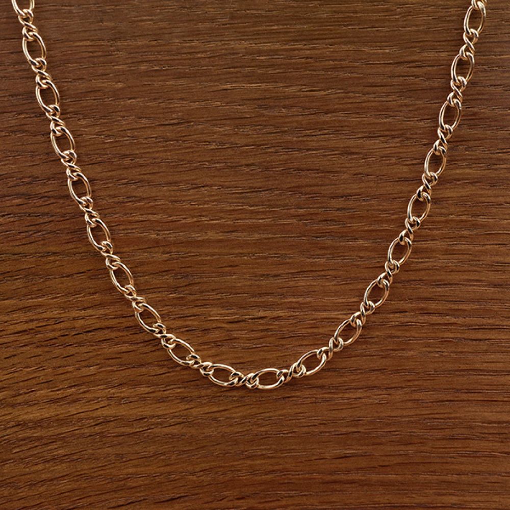 Twisted link Figaro 9ct yellow gold chain close up view