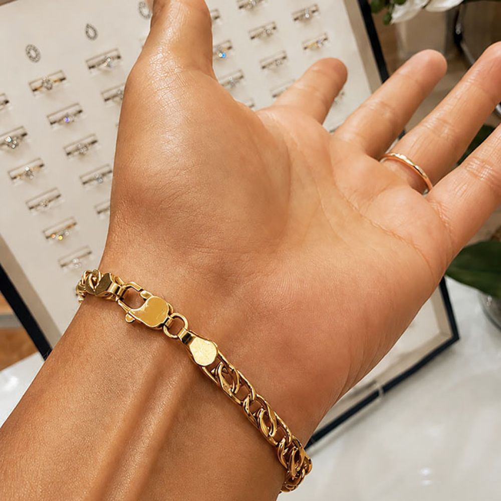 Japanese 18ct yellow gold bracelet on hand