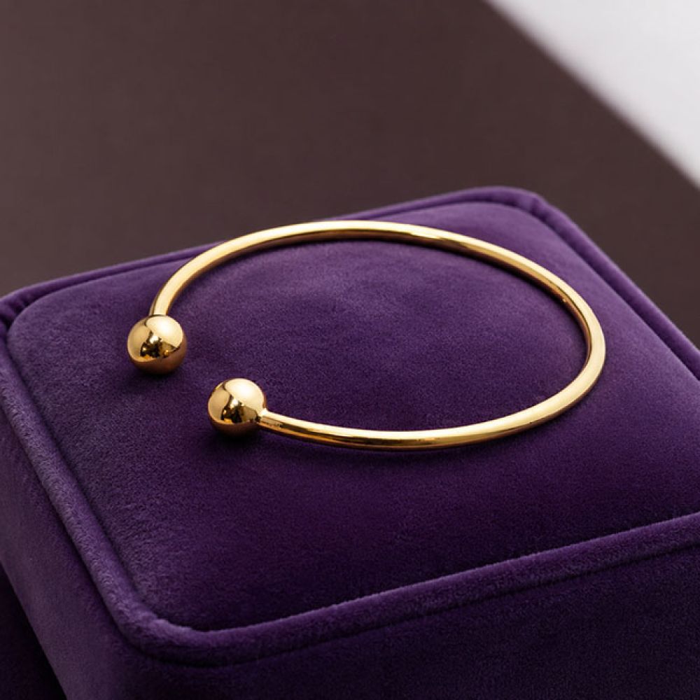 Pre-loved 22ct Yellow Gold Torque Ball Bangle on Velvet Pad