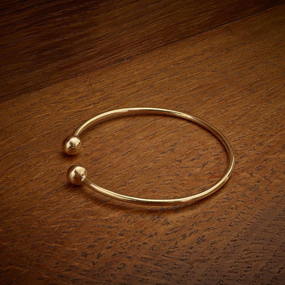 Pre-loved 22ct Yellow Gold Torque Ball Bangle on Velvet Pad