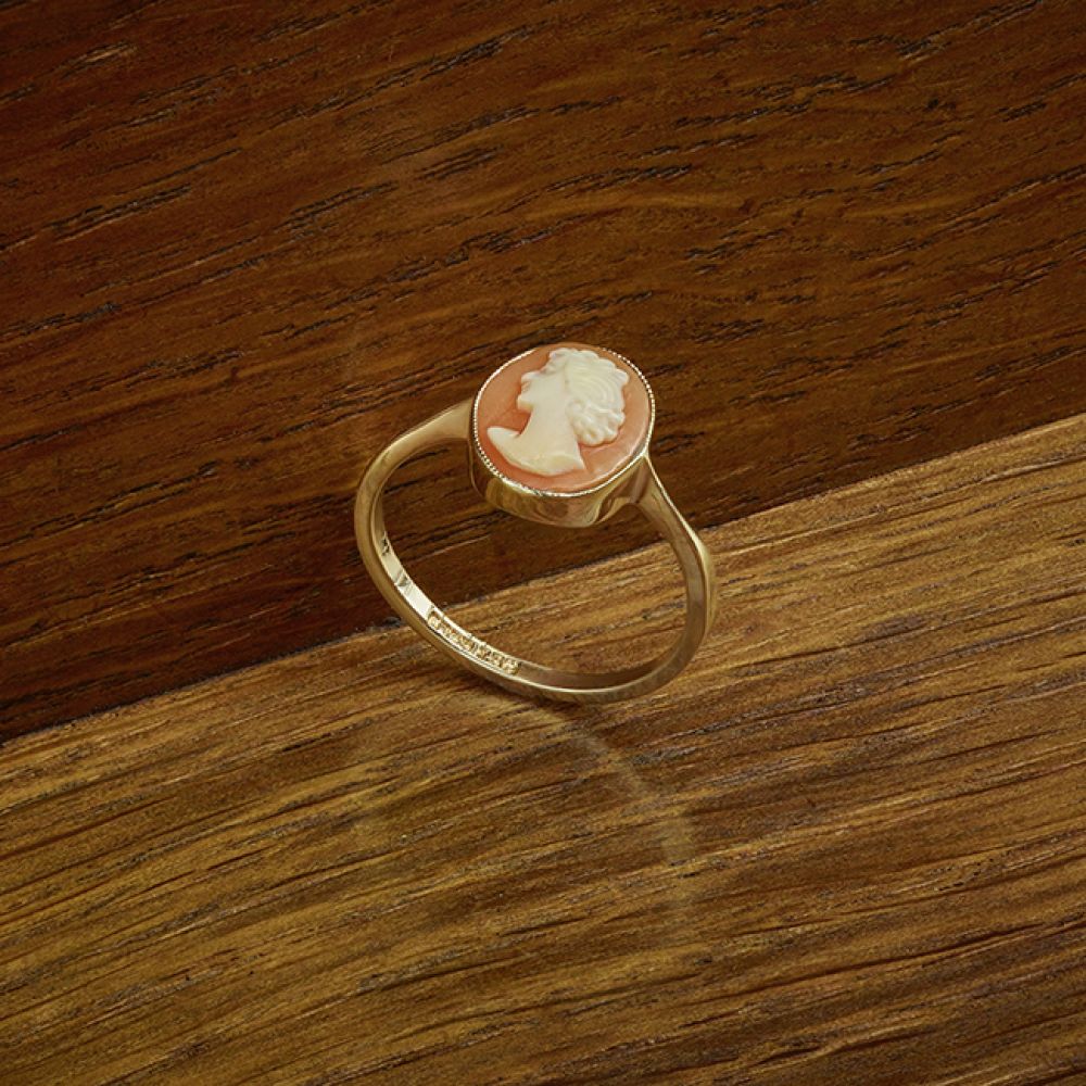 Pre-Loved Vintage Gold Cameo Ring on Wood Background