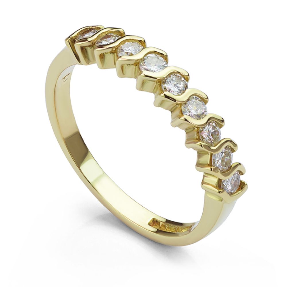 9 stone half eternity ring in yellow gold white background