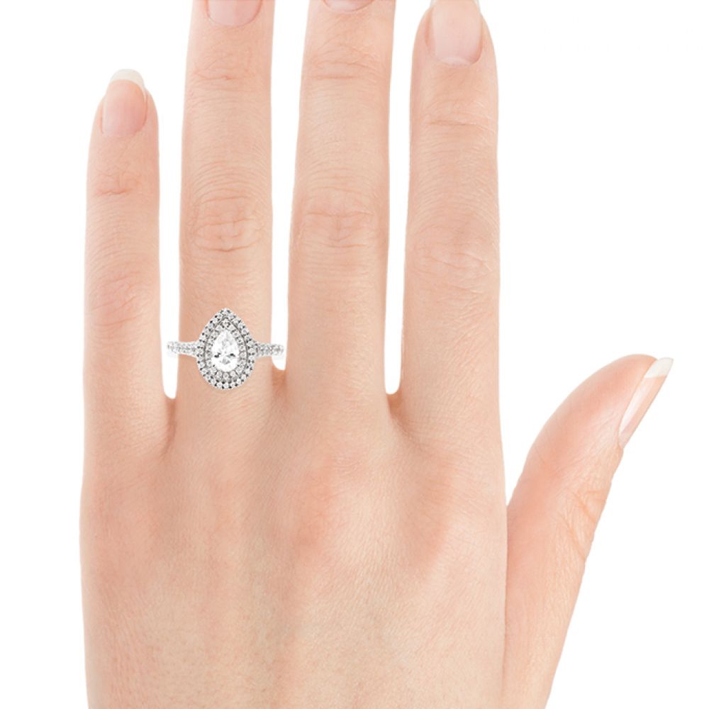 Pear shaped double halo engagement ring on hand