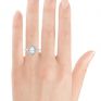 Pear shaped double halo engagement ring on hand Pear shaped double halo engagement ring on hand
