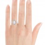 Pear shaped double halo engagement ring on hand Pear shaped double halo engagement ring on hand
