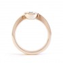 Asymmetrical engagement ring rose gold side view Asymmetrical engagement ring rose gold side view