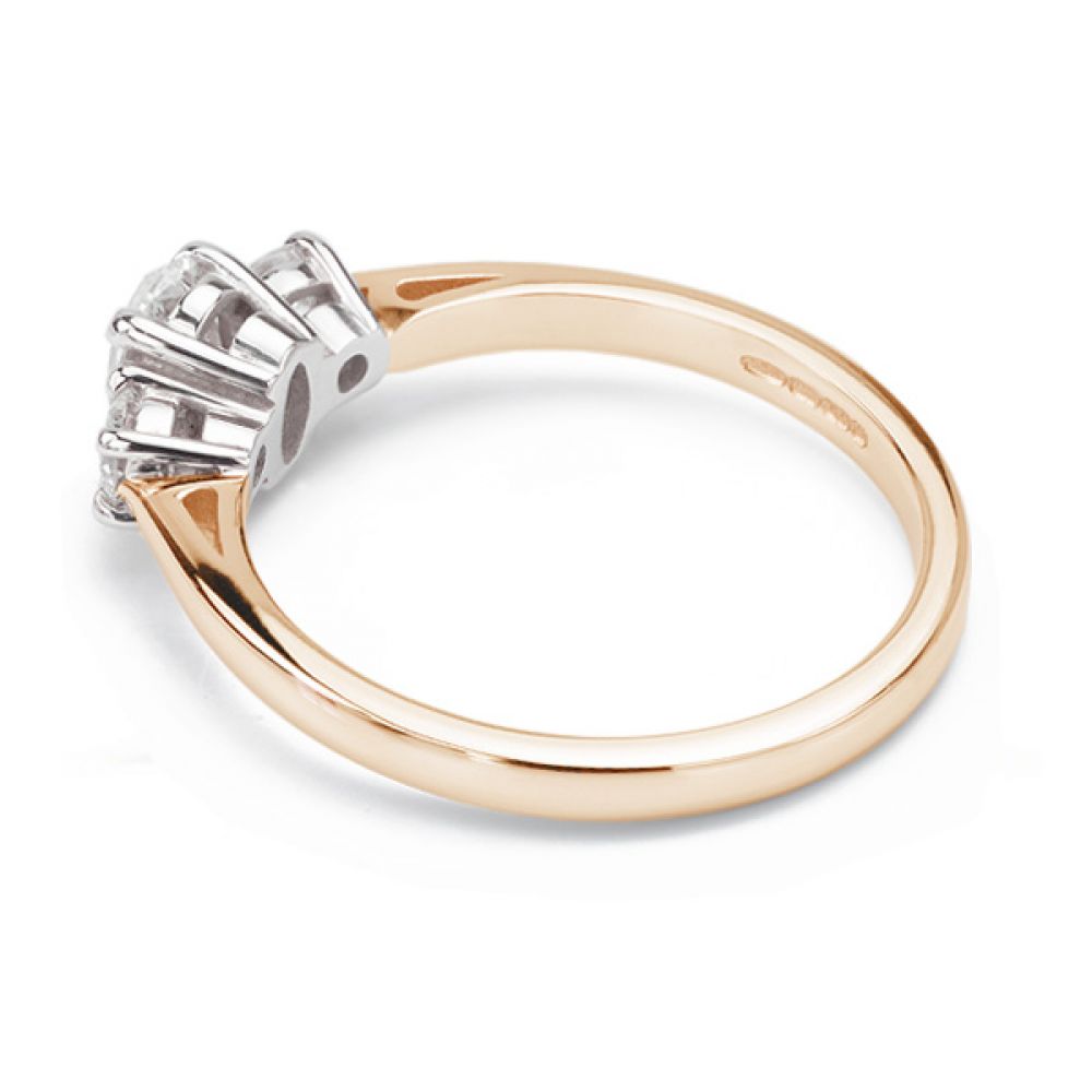 Oval and round diamond three stone ring side view rose gold