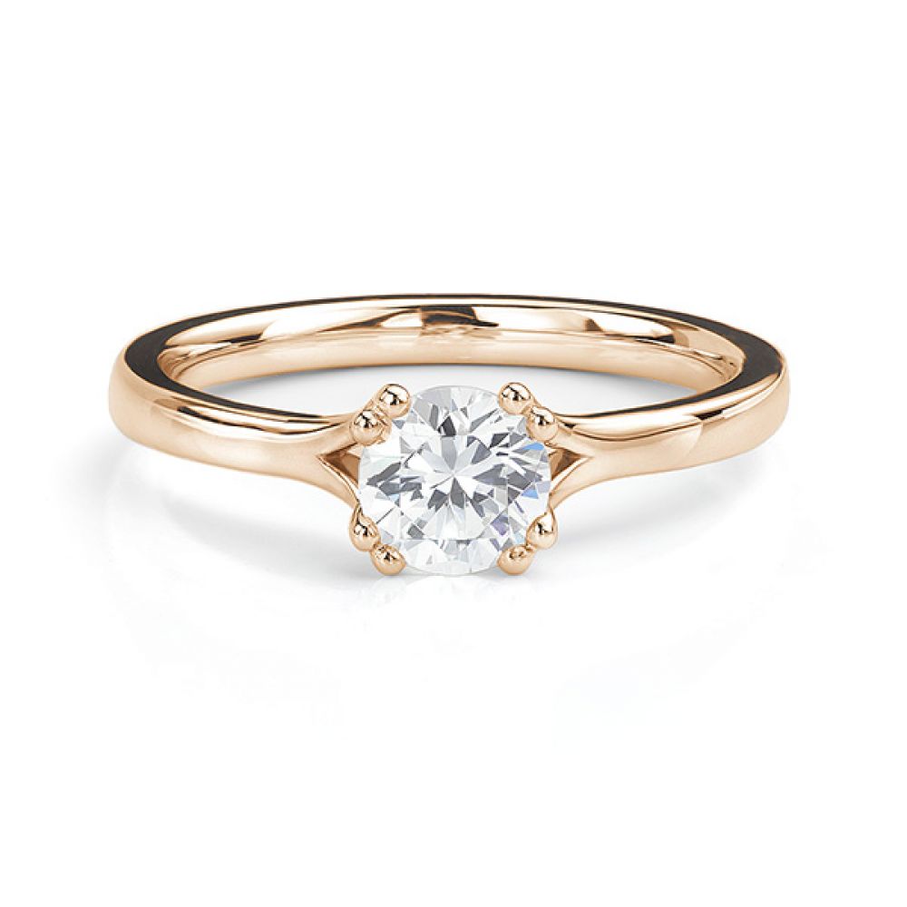 Rose gold double claw engagement ring front view