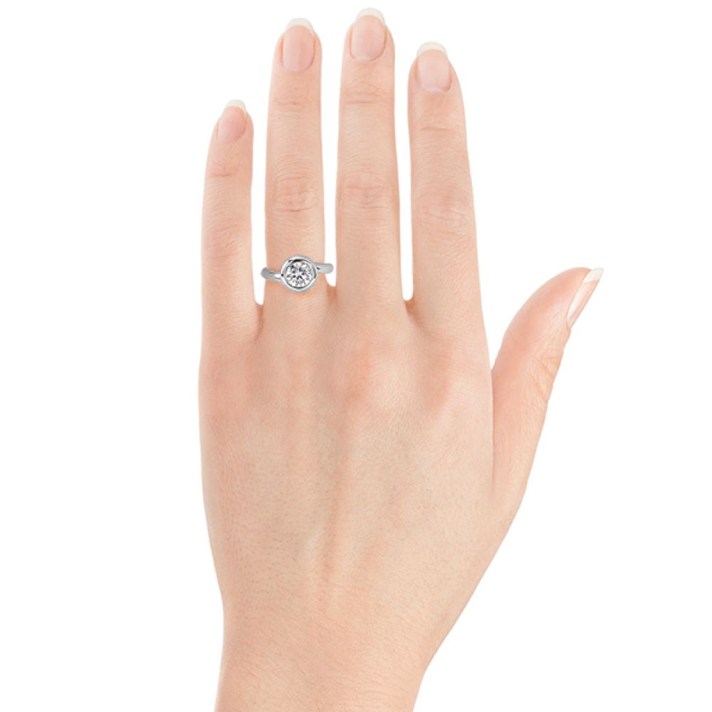 Domed solitaire diamond ring on the hand