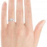 Heart shaped solitaire engagement ring on finger Heart shaped solitaire engagement ring on finger