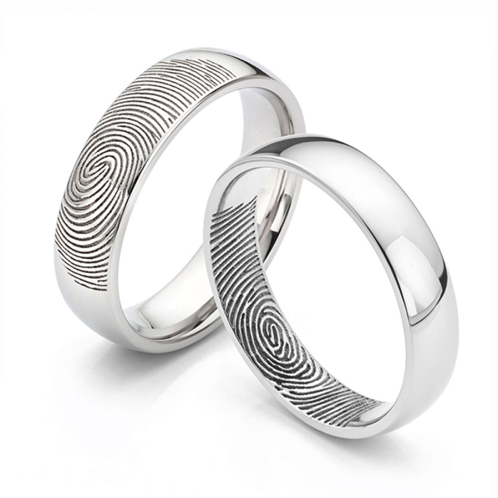 Fingerprint engraved on the outer surface and inner surface of wedding rings Fingerprint engraved on the outer surface and inner surface of wedding rings