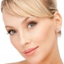 Four claw diamond stud earrings shown in ear Four claw diamond stud earrings shown in ear