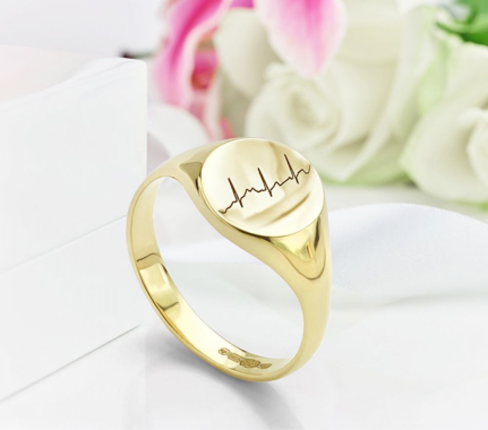 Mens signet ring with heartbeat engraving